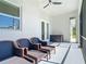 Outdoor covered patio seating and a fan for relaxing and entertaining at 2186 Yalta Ter, North Port, FL 34286