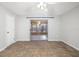 An empty bedroom showcasing tile flooring, a ceiling fan, and a sliding glass door leading to the lanai at 2645 Belvoir Blvd, Sarasota, FL 34237