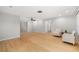 Bright living room with beautiful wood floors and neutral color palette at 2645 Belvoir Blvd, Sarasota, FL 34237