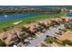 Aerial view of homes in the community near a golf course and lake at 322 Winding Brook Ln # 103, Bradenton, FL 34212