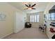 Bedroom featuring a closet, chair, and a ceiling fan at 322 Winding Brook Ln # 103, Bradenton, FL 34212