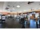 A gym featuring modern equipment, televisions, and ceiling fans at 322 Winding Brook Ln # 103, Bradenton, FL 34212