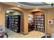A library with books organized on shelves with an AED at 322 Winding Brook Ln # 103, Bradenton, FL 34212