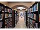 A library featuring books and arched doorways with recessed lighting at 322 Winding Brook Ln # 103, Bradenton, FL 34212