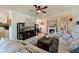 Bright living room featuring a fireplace, stylish furniture, and open layout at 322 Winding Brook Ln # 103, Bradenton, FL 34212