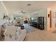 Bright living room featuring tile floors, comfortable seating, and sliding glass doors at 322 Winding Brook Ln # 103, Bradenton, FL 34212
