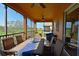 Screened patio featuring a dining table and view of the golf course at 322 Winding Brook Ln # 103, Bradenton, FL 34212