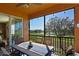 A covered patio with outdoor dining and a view of the golf course at 322 Winding Brook Ln # 103, Bradenton, FL 34212
