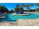 A swimming pool featuring a center island and lounge chairs at 322 Winding Brook Ln # 103, Bradenton, FL 34212
