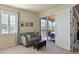 Bedroom sitting area with comfortable seating and access to a screened lanai at 322 Winding Brook Ln # 103, Bradenton, FL 34212