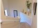 A staircase with neutral paint and carpet at 322 Winding Brook Ln # 103, Bradenton, FL 34212