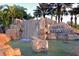 Scenic view of the River Strand waterfall and community entrance sign at 322 Winding Brook Ln # 103, Bradenton, FL 34212