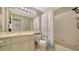 Well-lit bathroom with a shower/tub combo, vanity with sink, and safety features for accessibility at 3622 57Th Avenue W Dr # 62, Bradenton, FL 34210