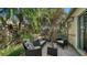 Charming outdoor seating area with stylish wicker furniture amidst lush tropical foliage at 3622 57Th Avenue W Dr # 62, Bradenton, FL 34210