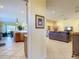 Open floor plan showing the living room with tiled floors and neutral walls, seamlessly connected to the kitchen area at 375 Fairway Isles Ln, Bradenton, FL 34212