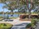 Picturesque lakeside picnic area with tables, grills, and scenic views for outdoor enjoyment at 375 Fairway Isles Ln, Bradenton, FL 34212