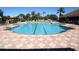 Large community pool with plenty of lounge chairs at 375 Fairway Isles Ln, Bradenton, FL 34212