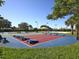 Active community shuffleboard court on a sunny day for residents' enjoyment and recreation at 375 Fairway Isles Ln, Bradenton, FL 34212
