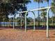 Traditional swing set in community playground, featuring wooden swings and safety surfacing at 375 Fairway Isles Ln, Bradenton, FL 34212