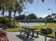 Community volleyball court with well-maintained sand and picnic benches for relaxing at 375 Fairway Isles Ln, Bradenton, FL 34212