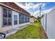 Backyard view showing the lush green grass, fenced perimeter, and the home's exterior at 4608 Park Acres Dr, Bradenton, FL 34207