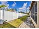 Backyard view showing the lush green grass, fenced perimeter, and the home's exterior at 4608 Park Acres Dr, Bradenton, FL 34207