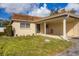 Cozy home with a carport, offering a neat lawn, garden, and easy access to the entrance at 4608 Park Acres Dr, Bradenton, FL 34207