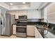 Modern kitchen with stainless steel appliances, granite countertops, and light wood cabinets at 4608 Park Acres Dr, Bradenton, FL 34207