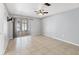 Bright living room with tile flooring, neutral paint and sliding doors to the outside at 4608 Park Acres Dr, Bradenton, FL 34207
