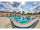 Community pool with lounge chairs and well-maintained landscaping, perfect for relaxation at 4608 Park Acres Dr, Bradenton, FL 34207