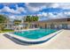 Community pool with clear water and blue trim, providing a refreshing amenity for residents at 4608 Park Acres Dr, Bradenton, FL 34207