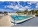 Community pool with clear water and blue trim, providing a refreshing amenity for residents at 4608 Park Acres Dr, Bradenton, FL 34207