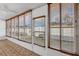 Enclosed sunroom with a doorway and an abundance of natural light from the large windows at 4608 Park Acres Dr, Bradenton, FL 34207