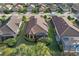 Aerial view of a home with a screened lanai and well-maintained landscaping at 5020 Savona Run, Bradenton, FL 34211