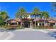 Beautiful community center featuring lush landscaping and decorative holiday accents at 5020 Savona Run, Bradenton, FL 34211