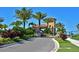 Community entrance gate with lush landscaping, providing security and curb appeal at 5020 Savona Run, Bradenton, FL 34211