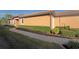 Well maintained home exterior showing a brick walkway bordered by manicured landscaping at 5020 Savona Run, Bradenton, FL 34211
