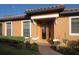 Charming front entrance with a beautiful glass inserted front door and paver walkway at 5020 Savona Run, Bradenton, FL 34211