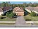Beautiful single-story home featuring a brick paved driveway and a well-manicured lawn at 5020 Savona Run, Bradenton, FL 34211