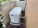 Generac home generator installed in the backyard near the wall and fence at 5020 Savona Run, Bradenton, FL 34211