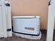 Generac generator, for the home, next to the wall and fence at 5020 Savona Run, Bradenton, FL 34211