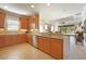 Well-lit kitchen with wooden cabinets, granite countertops, and stainless steel appliances at 5020 Savona Run, Bradenton, FL 34211