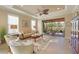 Spacious living room featuring natural light, tile flooring, and access to the lanai at 5020 Savona Run, Bradenton, FL 34211