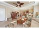 Open-concept living room featuring tile floors, comfortable seating and easy kitchen access at 5020 Savona Run, Bradenton, FL 34211