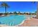 Expansive community swimming pool with a brick patio and plenty of lounge chairs for soaking up the sun at 5020 Savona Run, Bradenton, FL 34211