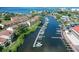 Picturesque aerial view of waterfront homes, docks, and boats on the canal at 625 Duchess Blvd, Dunedin, FL 34698