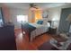 Cozy bedroom features built-in storage, wood floors, ceiling fan and comfy bed at 1750 Palm Springs St, Sarasota, FL 34234