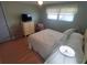 Bedroom with a large window, ceiling fan, and neutral colored walls at 1750 Palm Springs St, Sarasota, FL 34234