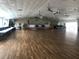 Large community hall with hardwood floors is perfect for social gatherings and events at 1750 Palm Springs St, Sarasota, FL 34234