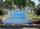 Charming entrance with a tranquil fountain, showcasing the Tri-Par Estates community sign at 1750 Palm Springs St, Sarasota, FL 34234